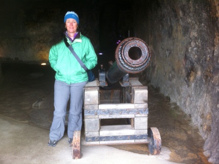Diane standing beside cannon in Luxembourg casemates