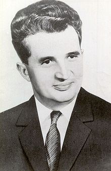 Black and white image of Nicolae Ceauşescu in suit and tie